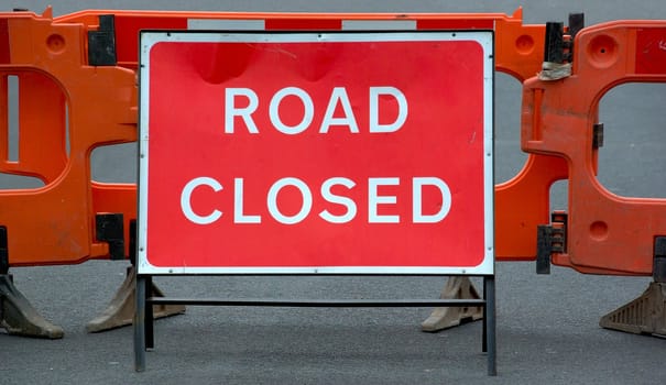 Temporary barricade across a road closed to traffic for construction work