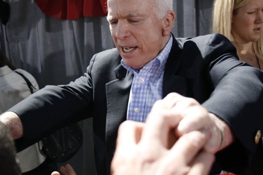 John McCain after speech meets people and shakes hands.  