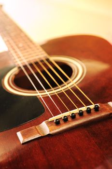 Musical instrument acoustic guitar close up in perspective
