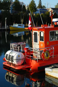 Fishing boats at the wooden dock in early morning in Tobermory Ontario Canada