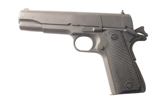 Semi -Automatic pistol cocked and ready to fire isolated on a white background