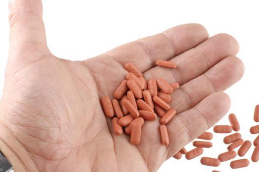 hand full of pain pills for someone addicted to them