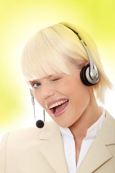 Call center woman with headset. Over abstract green background