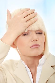 Young businesswoman with headache,Over abstract blue background