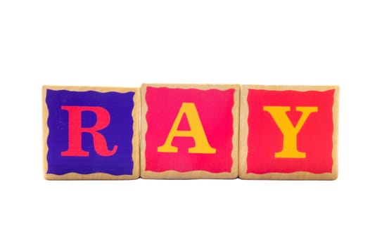 Childrens wooden play alphabet play blocks isolated on a white background spelling the word RAY
