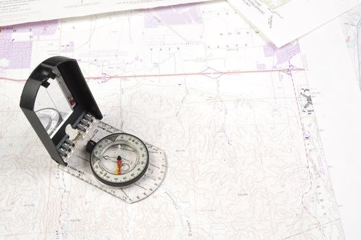 Topographical maps of an area under development with a acompass 