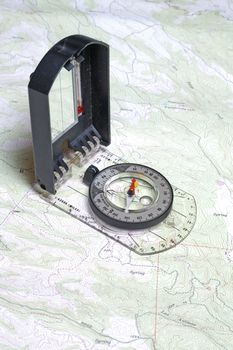 Closeup of compass and a topographical map showing detail