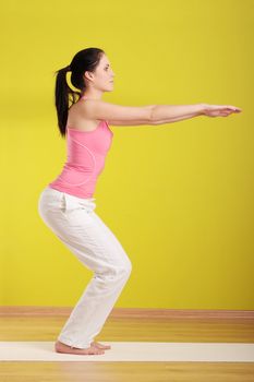 Young beautiful caucasian woman exercising at home