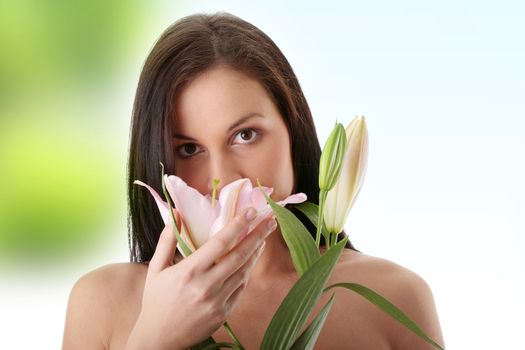 Beautiful young woman with lily flower.