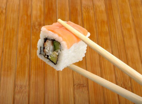 sushi in wooden chopsticks
