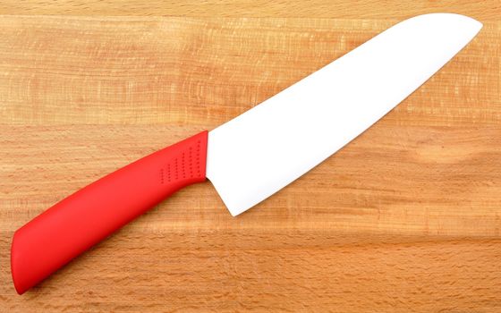 ceramic knife on wooden background