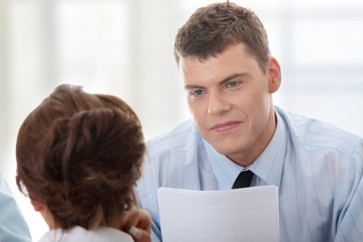 Business coaching concept. Young woman being interviewed for a job.