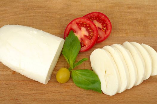 mozzarella cheese on a wooden background