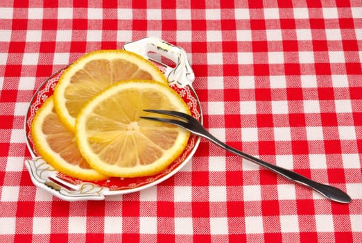 lemon on a plate with a fork