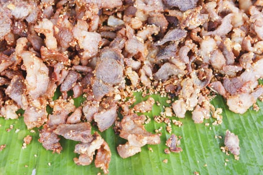 Deep fried pork with sesame on banana leaf, thai style