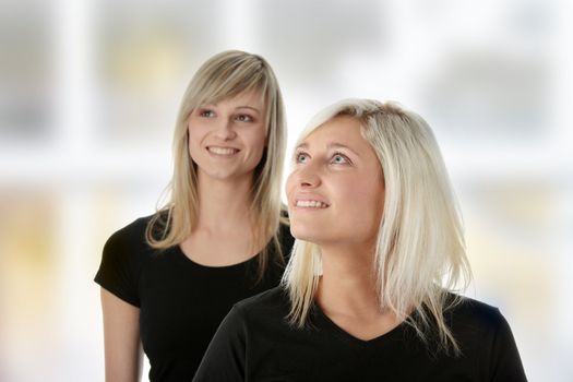 Happy young women friends laughing