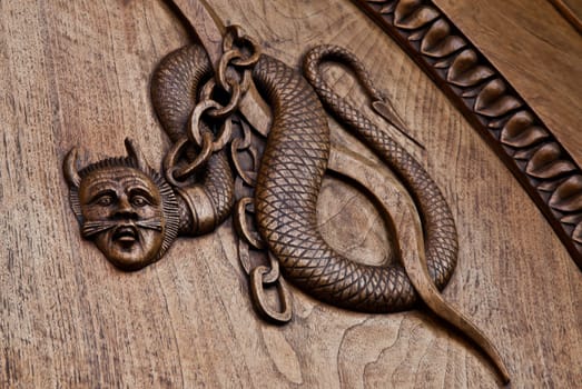 Medieval demon on antique door- Sacra di San Michele (St. Michael Abbey) - Torino - Italy