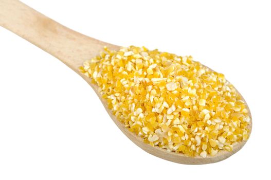 corn grits on wooden spoon, isolated on a white background