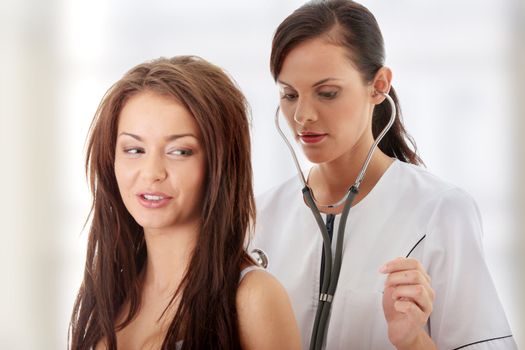 Young female doctor with female patient.