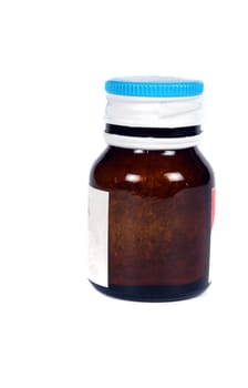 A medicine bottle, on white studio background.