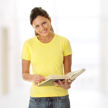 Teen woman reading book