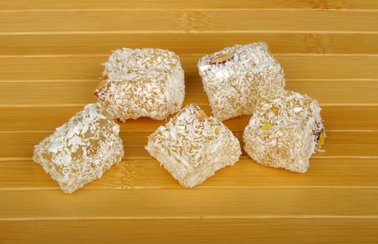 Sweet pieces of turkish delight on mat