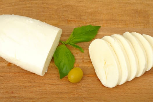 mozzarella cheese on a wooden background