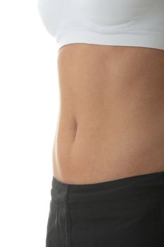 Midsection of a physically fit young woman over white background