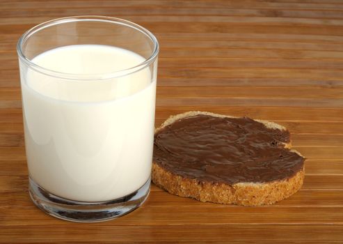 milk and a sandwich with peanut butter