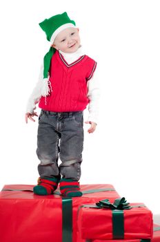 Shot of christmas toddler with presents isolated on white