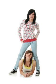 Two teen sisters isolated on white background