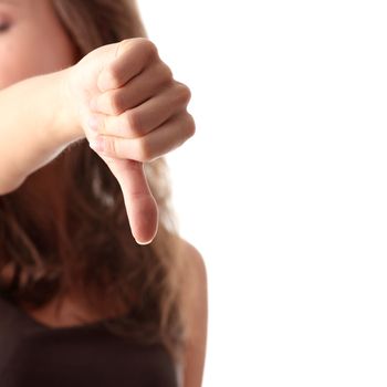 Young woman showing thumbs down isolated