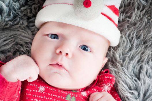 Shot of little cute baby in red