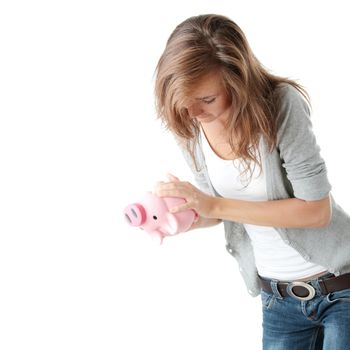 Young beautiful woman standing with piggy bank (money box), isolated on white background