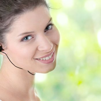 Young fitness woman with sport headphones listening music isolated