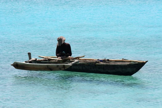 A fisherman on a quiet sunny day