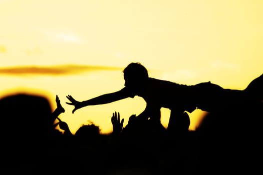 people celebrating on an open air shillouettes