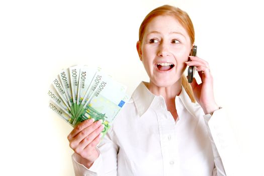 Happy woman holds many bills in his hand and calls
