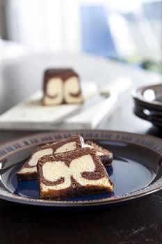 Three slices of tempting chocolate and lemon flavored marble cake.