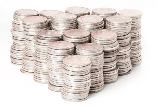 Many stacks of old silver dimes face on to camera