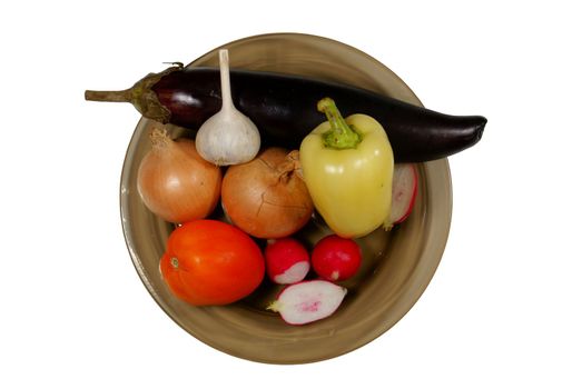 Plate with vegetables. Separately on a white background