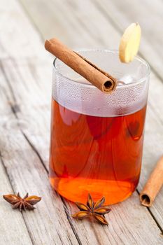 spiced tea over wood background