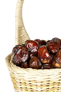 dates in the basket,isolated on a white background