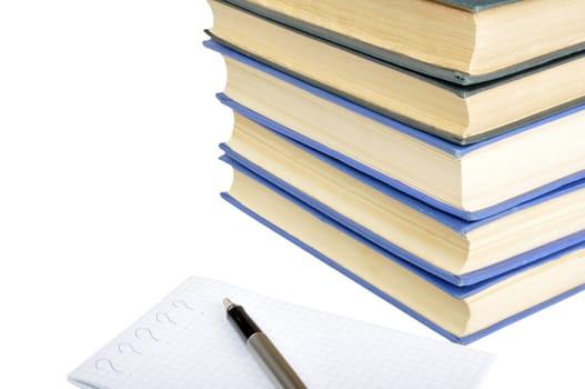 old books, notebook and pen