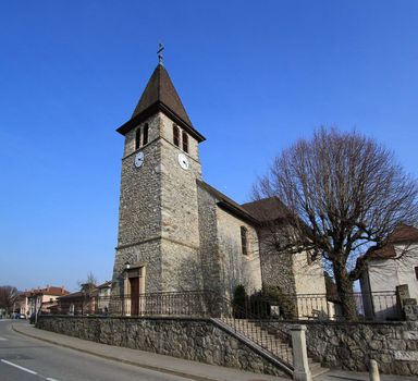 Veigy-Foncenex old catholic parish next to the road of the village by beautiful weather, France