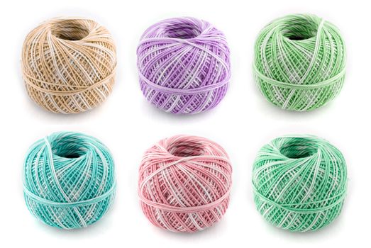 spools of many colors on a white background.