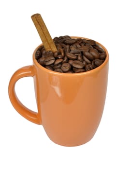 coffee beans and cinnamon in a mug