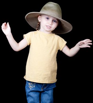 An adorable young child with an oversized hat on.  She looks as if she is explaining something.
