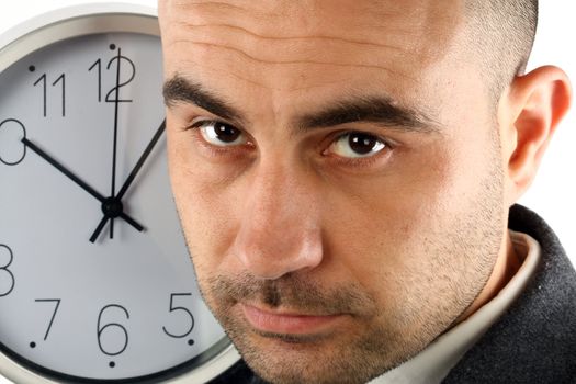 Close up portrait of a businessman and clock. Time for work concept