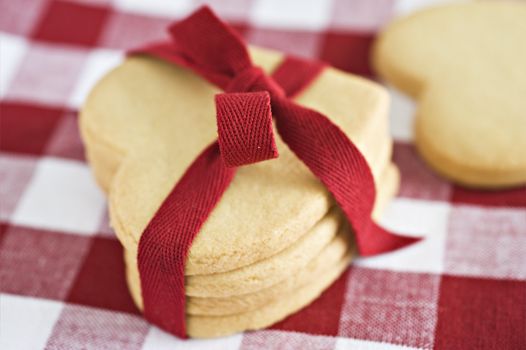 Heart shaped cookies with a red ribbon